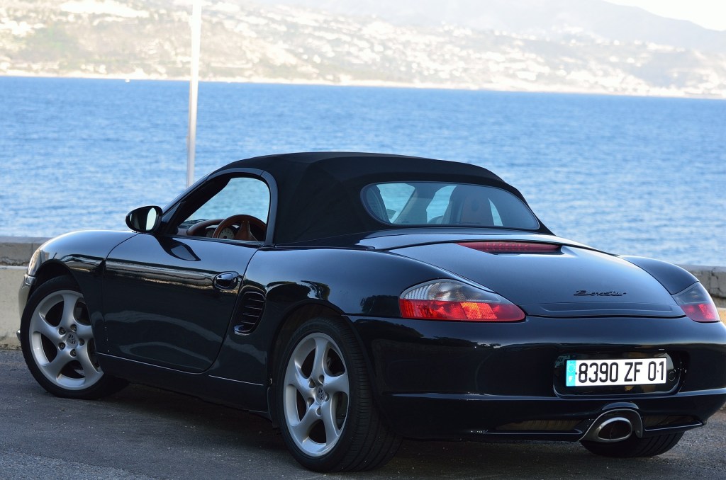 Rear view of a black Porsche Boxster.